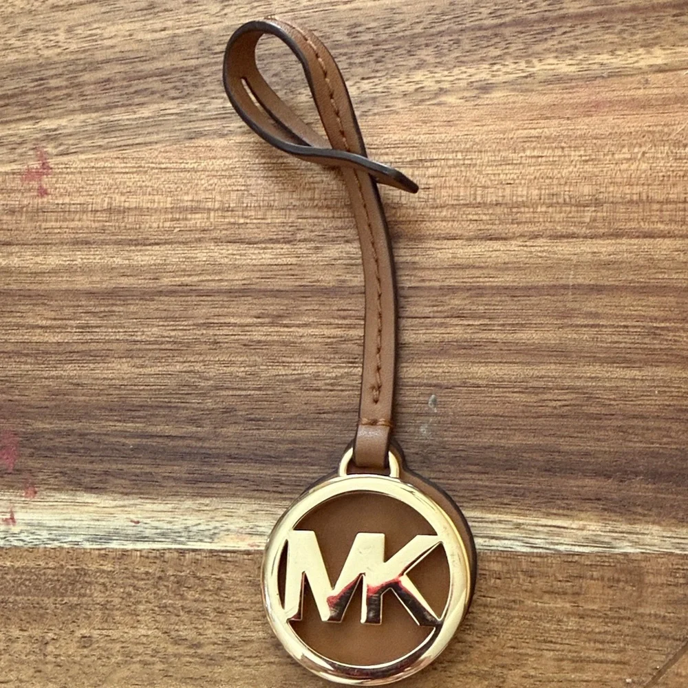 Michael Kors Brown and Gold bag tag